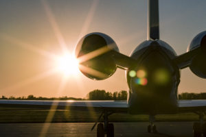 new united goderich plane infront of a sunset