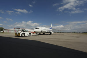 new united goderich plane being towed on the runway