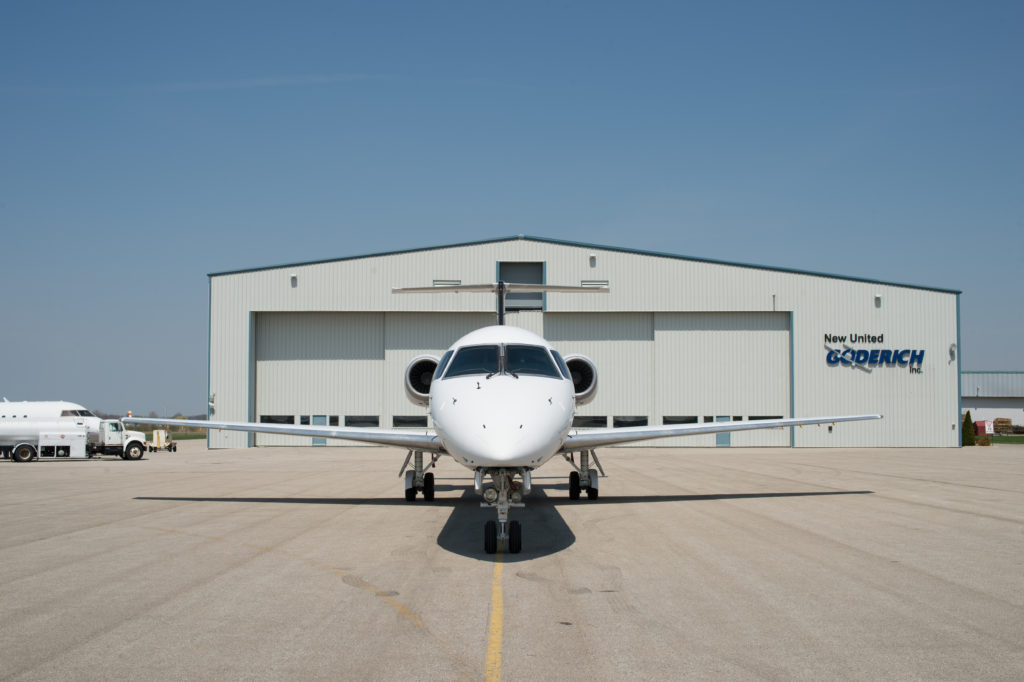 white aircraft in front of new united goderich hangar