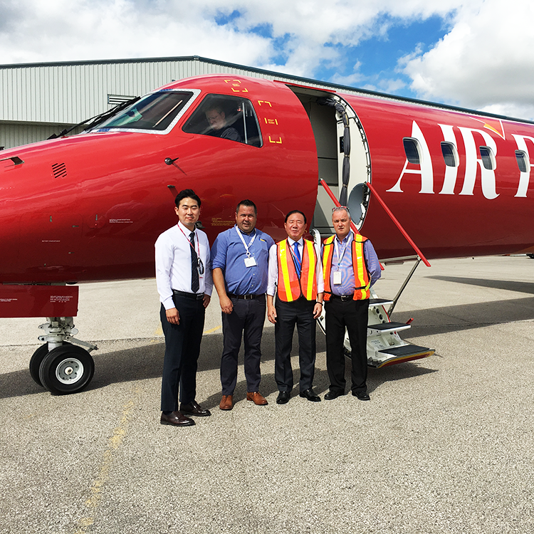 blair and greg delivering red embraer erj145 to client