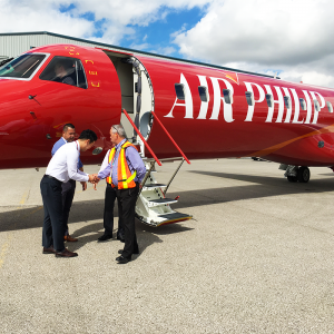 new united goderich with client outside red embraer erj145