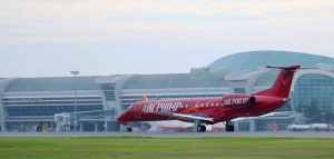 red embraer erj landing home in south korea airport