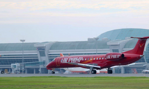 red embraer erj landing home in south korea airport