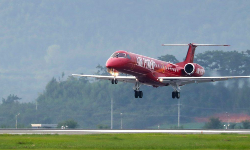 red embraer erj145 landing on runway in south korea